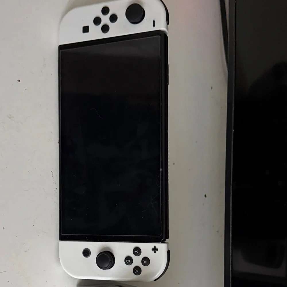 Nintendo Switch OLED White Handheld Gaming Console with Dual Analog Controls